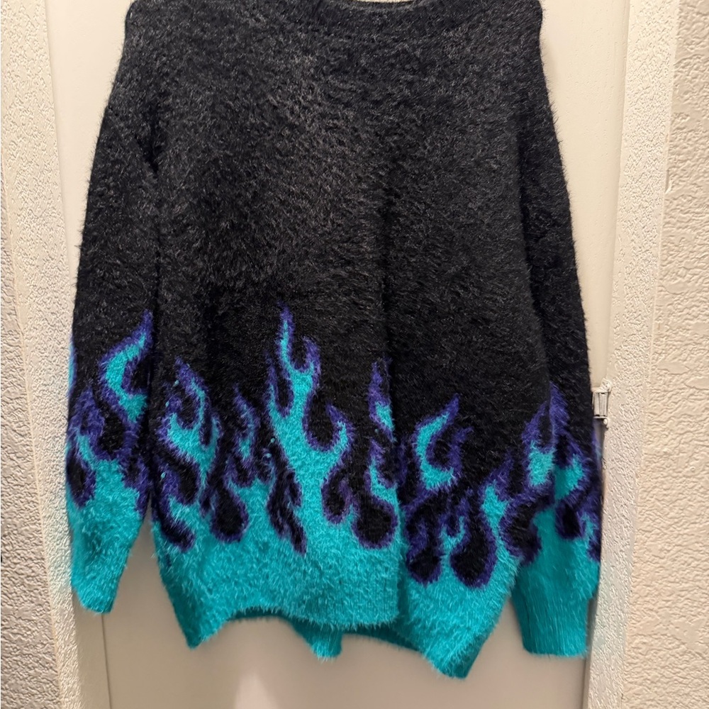 Adika black and blue flame sweater